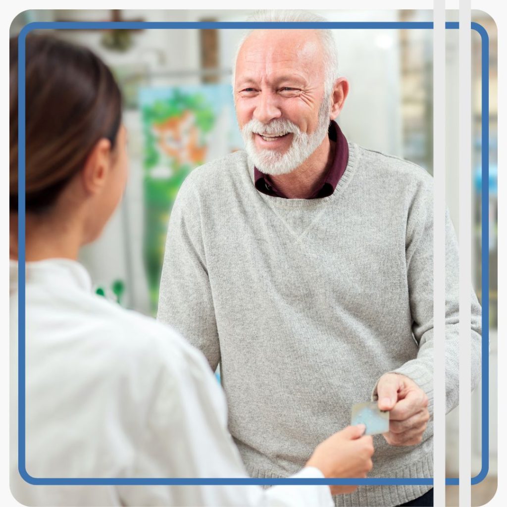 man paying at pharmacy